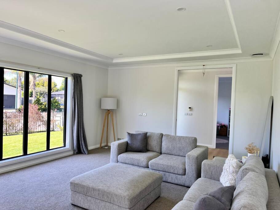 Sunny Delight In Clive Villa Bagian luar foto